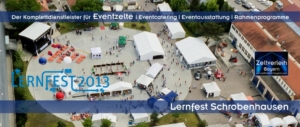 Luftaufnahme des Lernfests auf einem Betriebsgelände der Firma Bauer in Schrobenhausen mit zahlreichen Eventzelten und Eventmodulen von Schätzl Ereignismanagement.